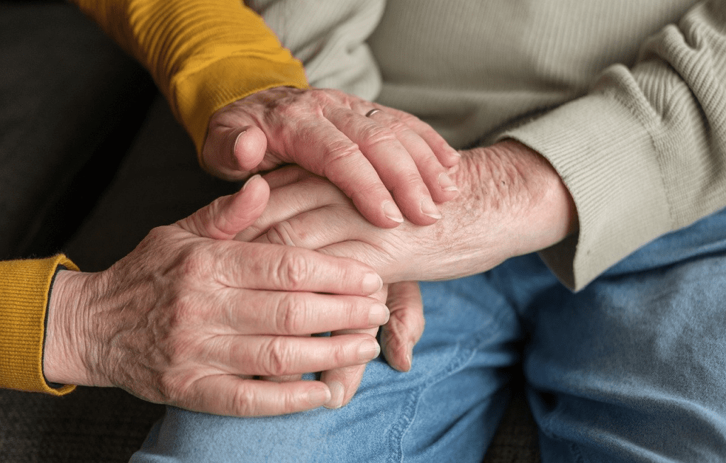 Old hands holiding each other