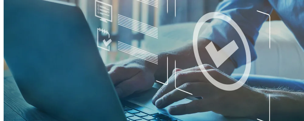 Web banner of laptop with a tick in a circle